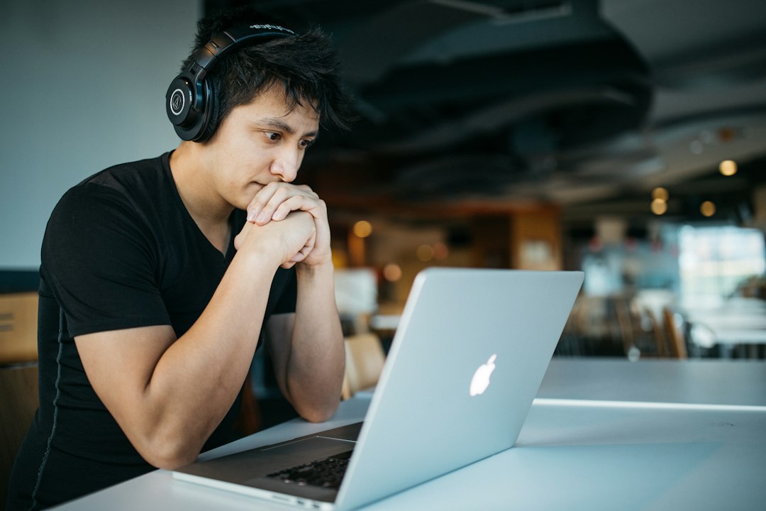 Student with headphones taking an online training course